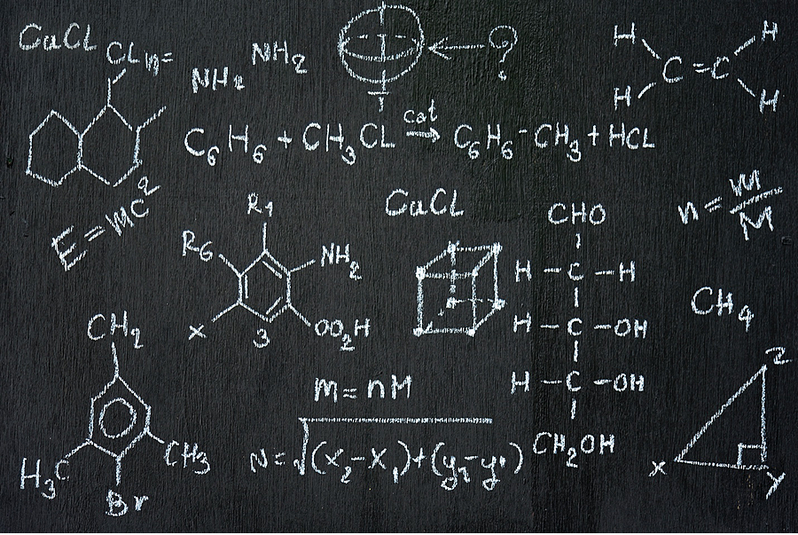 Chalkboard full of chemical and mathematical symbols