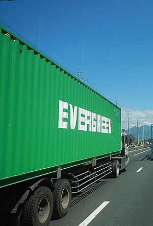 Photo of a semi-truck driving down the highway